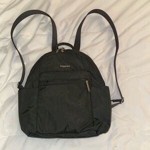 Baggallini anti-theft backpack with RFID blocking and safety locking closures